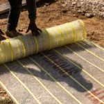 a person rolling a mesh mat